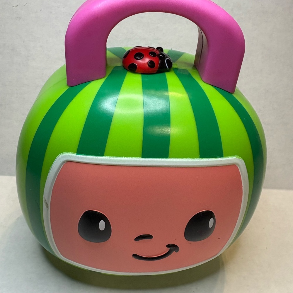 Smiling Green and Pink Toy with Ladybug Accent